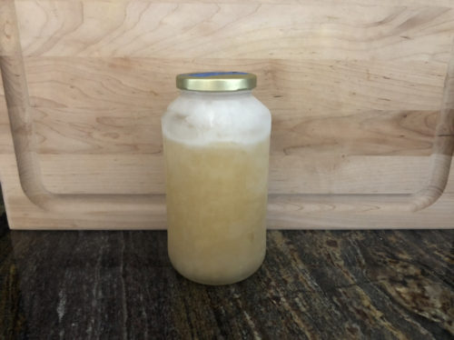 frozen turkey stock in glass jar